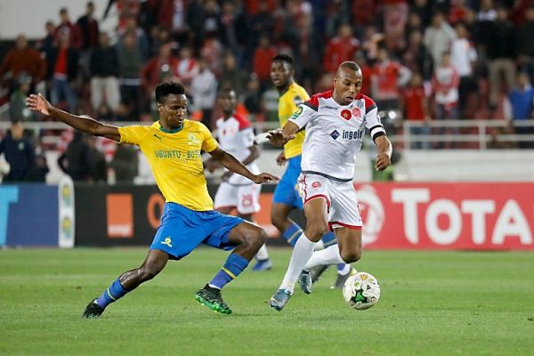 Sundowns' Themba Zwane (L) fights for the ball with Wydad's Brahim Nakach during the first leg of the CAF Champions League semi final football match between South Africa's Mamelodi Sundowns and Morocco's Wydad Athletic Club at the Prince Moulay Abdellah complex' Stadium in Rabat on April 26, 2019. PHOTO | AFP