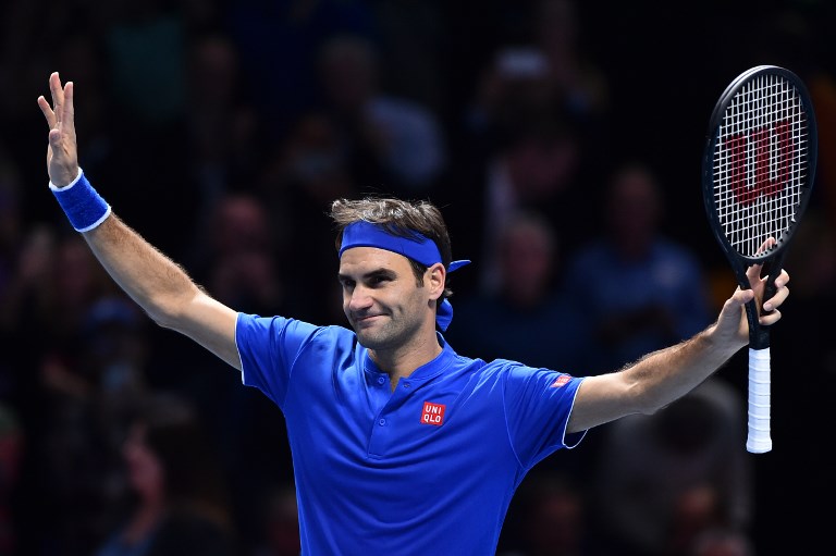 Switzerland's Roger Federer celebrates beating Austria's Dominic Thiem during their men's singles round-robin match on day three of the ATP World Tour Finals tennis tournament at the O2 Arena in London on November 13, 2018. PHOTO/AFP