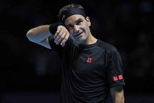 Switzerland's Roger Federer gestures against Austria's Dominic Thiem during their men's singles round-robin match on day one of the ATP World Tour Finals tennis tournament at the O2 Arena in London on November 10, 2019. PHOTO | AFP