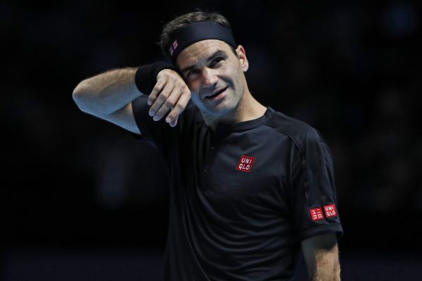 Switzerland's Roger Federer gestures against Austria's Dominic Thiem during their men's singles round-robin match on day one of the ATP World Tour Finals tennis tournament at the O2 Arena in London on November 10, 2019.  PHOTO | AFP