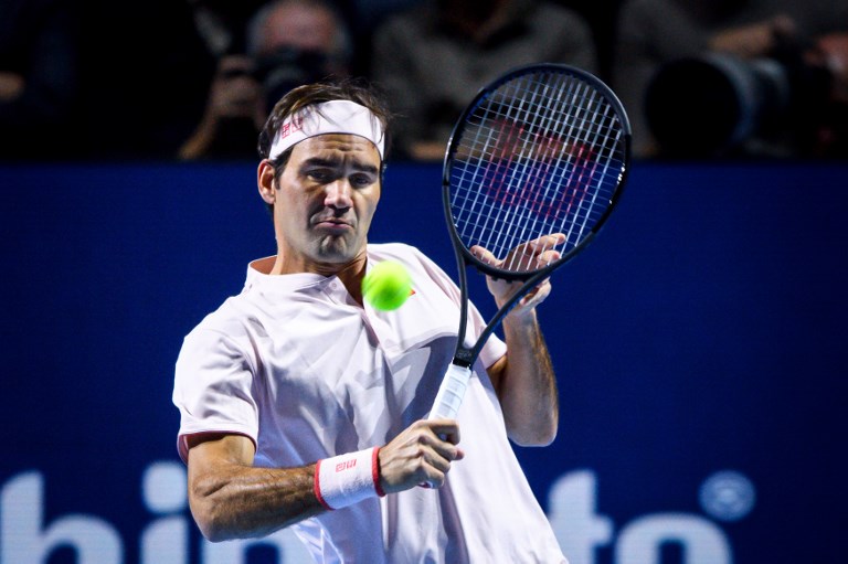 Switzerland's Roger Federer returns a ball to Romania's Marius Copil during their final match at the Swiss Indoors ATP 500 tennis tournament on October 28, 2018 in Basel. PHOTO/AFP