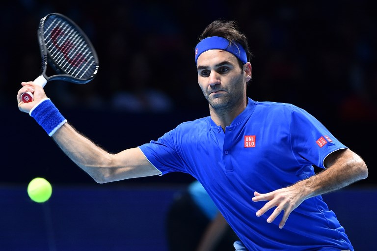 Switzerland's Roger Federer returns against South Africa's Kevin Anderson in their men's singles round-robin match on day five of the ATP World Tour Finals tennis tournament at the O2 Arena in London on November 15, 2018. PHOTO/AFP