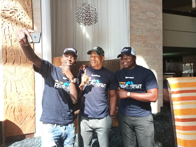 Tanzanian social media influencers, Daudi Maguya@sharogangstar (left) and Venance Veruli@venancetemba (right) takes a selfie with boxing sensation Hassan ‘Champez’ Mwakinyo at the latters hotel in Nairobi on  March 23, 2019. PHOTO/ SPN