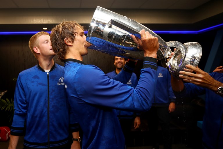 Team Europe Alexander Zverev of Germany celebrates with the trophy in the locker room after winning the Laver Cup on day three of the 2018 Laver Cup at the United Center on September 23, 2018 in Chicago, Illinois. PHOTO/AFP