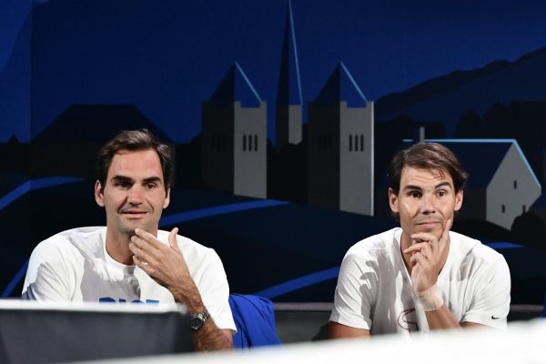 Team Europe's Roger Federer (L) and teammate Rafael Nadal watch a match as part of the 2019 Laver Cup tennis tournament in Geneva, on September 20, 2019. PHOTO | AFP