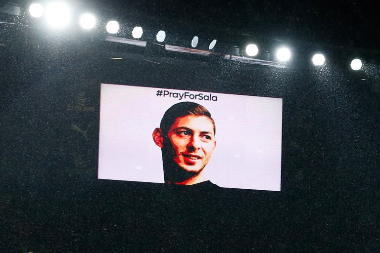The big screen shows the face of Cardiff City's missing Argentinian player Emiliano Sala during a moments silence in his honour ahead of the English Premier League football match between Arsenal and Cardiff City at the Emirates Stadium in London on January 29, 2019. PHOTO/AFP
