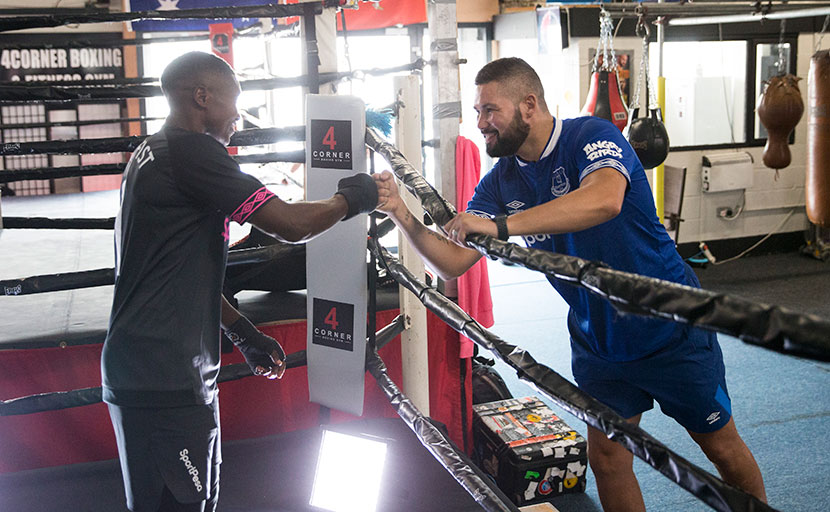 The fist high of champions. Kenya's WBC Super Bantamweight women's titleholder, Fatuma Zarika (left) and England's WBC Cruiserweight champion, Tony Bellew meet during her training in the UK. PHOTO/SPN