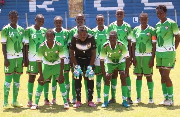 The Kenya U20 women team poses for a photo before a past buildup friendly match against the National U13 boys team at the Machakos Stadium. PHOTO/ FKF