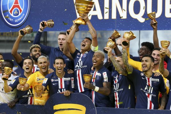Thiago Silva of PSG holding the League Cup, Pablo Sarabia, goalkeeper Keylor Navas, Angel Di Maria, Presnel Kimpembe, Leandro Paredes and teammates celebrate the victory during the trophy ceremony following the French League Cup (Coupe de la Ligue) final match between Paris Saint-Germain (PSG) and Olympique Lyonnais (OL, Lyon) on July 31, 2020 at the Stade de France, in Saint-Denis, near Paris, France. PHOTO | AFP