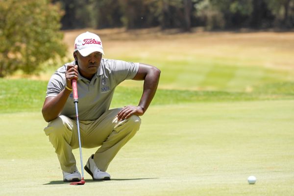 Thika Golf Club's Simon Ngige lines up a putt on the final round of the 2019 Magical Kenya Open Golf Championship. He finished the tournament with a 5-under par score to tie in 25th. PHOTO/Courtesy