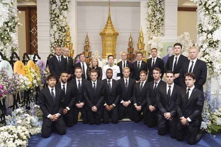 This handout photo taken and released by King Power on November 4, 2018 shows Leicester City team posing with Aiyawatt Srivaddhanaprabha (C in white uniform) son of Leicester City's Thai owner and duty-free mogul.PHOTO/AFP