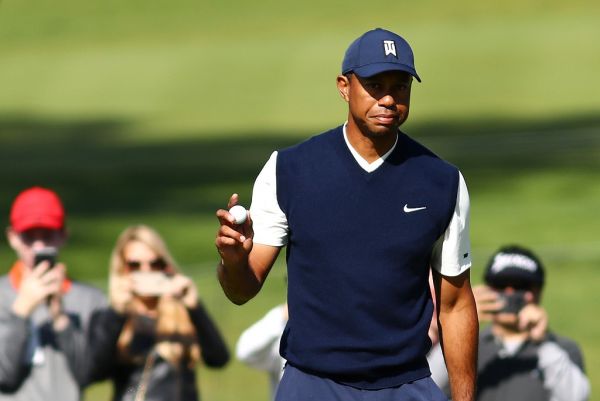 Tiger Woods of the United States acknowledges fans on the 15th green during the third round of the Genesis Invitational at Riviera Country Club on February 15, 2020 in Pacific Palisades, California. PHOTO | AFP