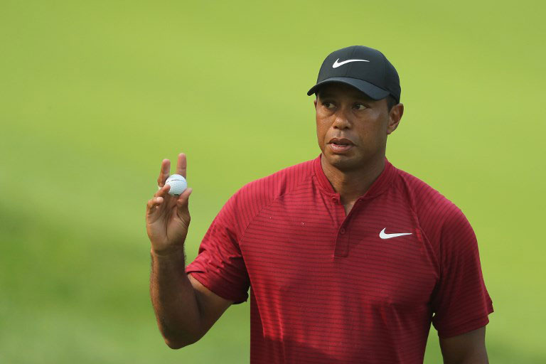 Tiger Woods of the United States acknowledges the crowd on the 15th green during the final round of the 2018 PGA Championship at Bellerive Country Club on August 12, 2018 in St Louis, Missouri. PHOTO/AFP