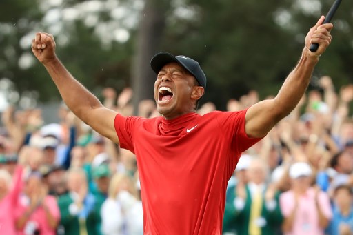 Tiger Woods of the United States celebrates after sinking his putt on the 18th green to win during the final round of the Masters at Augusta National Golf Club on April 14, 2019 in Augusta, Georgia. Andrew. PHOTO/AFP