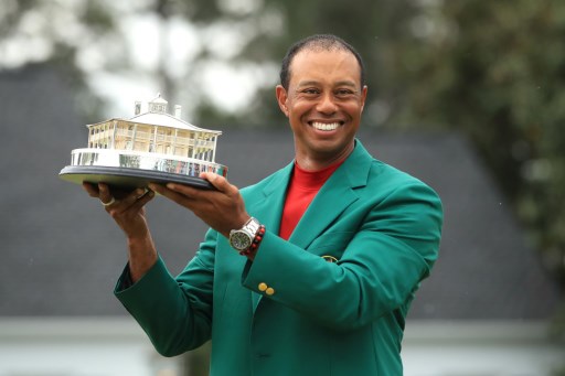 Tiger Woods of the United States celebrates with the Masters Trophy during the Green Jacket Ceremony after winning the Masters at Augusta National Golf Club on April 14, 2019 in Augusta, Georgia. PHOTO/AFP