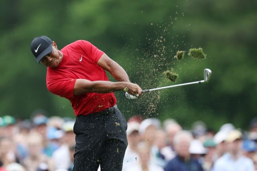 Tiger Woods of the United States plays a shot from the 12th tee during the final round of the Masters at Augusta National Golf Club on April 14, 2019 in Augusta, Georgia. PHOTO/AFP