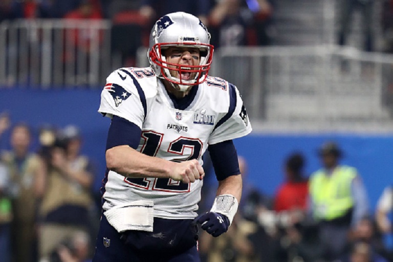 Tom Brady #12 of the New England Patriots celebrates his teams fourth quarter touchdown against the Los Angeles Rams during Super Bowl LIII at Mercedes-Benz Stadium on February 03, 2019 in Atlanta, Georgia. PHOTO/GettyImages