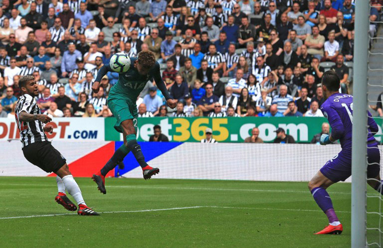 Tottenham Hotspur's English midfielder Dele Alli (C) heads the ball to score his team's second goal during the English Premier League football match between Newcastle United and Tottenham Hotspur at St James' Park in Newcastle-upon-Tyne, north east England on August 11, 2018. PHOTO/AFP