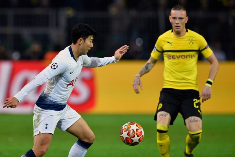 Tottenham Hotspur's South Korean striker Son Heung-Min (L) amd Dortmund's German midfielder Marius Wolf vie for the ball during the UEFA Champions League round of 16 second leg football match between BVB Borussia Dortmund and Tottenham Hotspur on March 5, 2019 in Dortmund, western Germany.PHOTO/ AFP