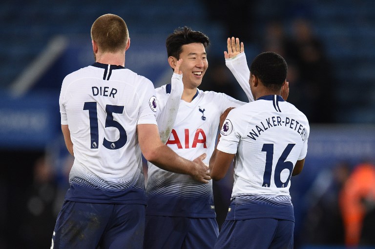 Tottenham Hotspur's South Korean striker Son Heung-Min celebrates with Tottenham Hotspur's English defender Eric Dier and Tottenham Hotspur's English defender Kyle Walker-Peters after winning the English Premier League football match between Leicester City and Tottenham Hotspur at the King Power Stadium in Leicester, central England on December 8, 2018. PHOTO/AFP