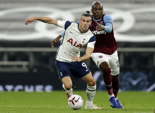 Tottenham Hotspur's Welsh striker Gareth Bale (L) and West Ham United's Italian defender Angelo Ogbonna compete for the ball during the English Premier League football match between Tottenham Hotspur and West Ham United at Tottenham Hotspur Stadium in London, on October 18, 2020. PHOTO | AFP