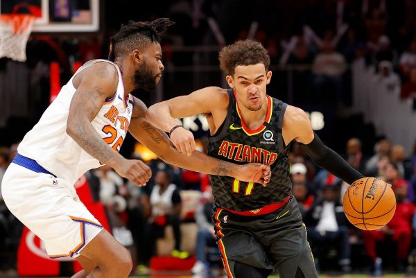 Trae Young #11 of the Atlanta Hawks drives against Reggie Bullock #25 of the New York Knicks in double overtime at State Farm Arena on February 09, 2020 in Atlanta, Georgia. PHOTO | AFP