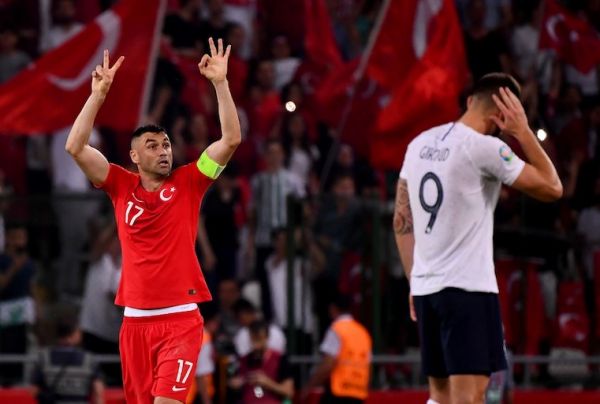 Turkey's forward Burak Yilmaz (L) celebrates after his teammate Turkey's Midfielder Cengiz Under scores his team's second goal during the Euro 2020 football qualification match between Turkey and France at the Buyuksehir Belediyesi stadium in Konya, on June 8, 2019. PHOTO/AFP