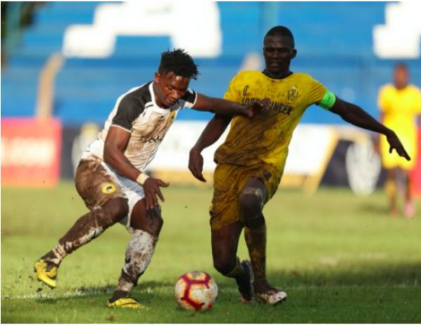 Tusker FC's George 'Blackberry' Ogutu (left) shields the ball in a recent league match against Wazito FC. PHOTO | DUNCAN SIRMA | SPN