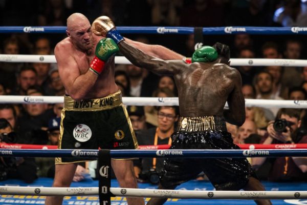 Tyson Fury (L) in action against Deontay Wilder (R) during WBC Heavyweight Championship at the Staples Center in Los Angeles, California on December 01, 2018. PHOTO | AFP