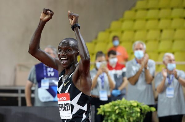 Uganda's Joshua Cheptegei celebrates after winning and breaking the world record in the men's 5000metre event during the Diamond League Athletics Meeting at The Louis II Stadium in Monaco on August 14, 2020. PHOTO | AFP