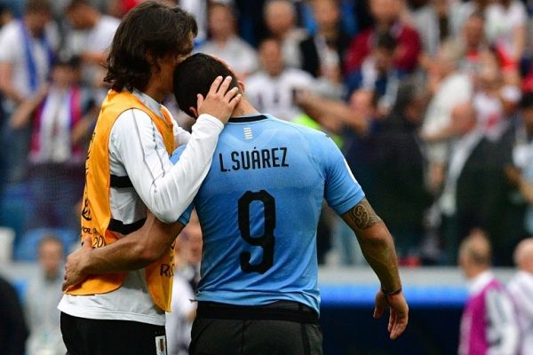 Uruguay's forward Edinson Cavani (L) comforts Uruguay's forward Luis Suarez as they react to France's victory at the end of the the Russia 2018 World Cup quarter-final football match between Uruguay and France at the Nizhny Novgorod Stadium in Nizhny Novgorod on July 6, 2018. PHOTO | AFP