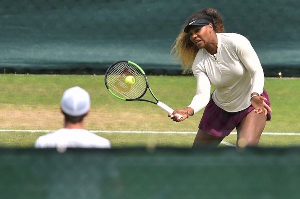 US player Serena Williams (R) and Britain's Andy Murray take part in a session on the practice courts on day nine of the 2019 Wimbledon Championships at The All England Lawn Tennis Club in Wimbledon, southwest London, on July 10, 2019.  Glyn KIRK / AFP