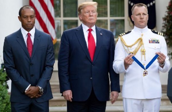 US President Donald Trump presents US golfer Tiger Woods with the Presidential Medal of Freedom during a ceremony in the Rose Garden of the White House in Washington, DC, on May 6, 2019. PHOTO/AFP