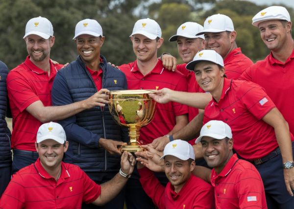 US team captain Tiger Woods (top row, 2nd L) and his teammates pose with the Presidents Cup after their win over the International Team on the final day of the Presidents Cup golf tournament in Melbourne on December 15, 2019. PHOTO | AFP
