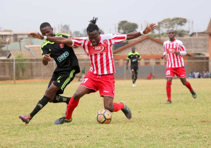 Ushuru FC midfielder Luis Masika keeps the ball out of his Kibera Black Stars FC marker's reach during their FKF National Super League match at the Hope Center.PHOTO/FKF