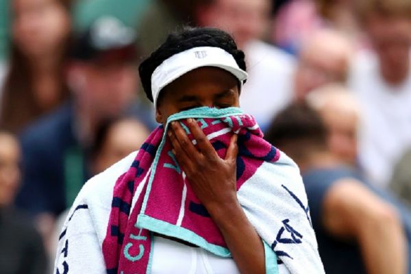 Venus Williams of The United States reacts as she sits down between games in her Ladies' Singles first round match against Cori Gauff of the United States during Day one of The Championships - Wimbledon 2019 at All England Lawn Tennis and Croquet Club on July 01, 2019 in London, England.PHOTO/ GETTY IMAGES