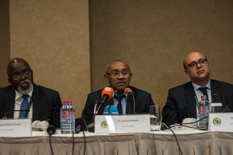 Vice President of the Confederation of African Football (CAF) Amaju Pinnink, President of CAF Ahmad Ahmad and Acting general secretary of CAF Essadik Alaoui look on during a press conference after an extraordinary meeting with CAF executives at the Kempinski Hotel in Accra on November 30, 2018.PHOTO/AFP