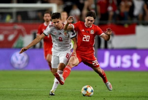 Wales' midfielder Daniel James (R) vies with Hungary's midfielder Adam Nagy (L) during the UEFA Euro 2020 qualifier Group E football match Hungary against Wales on June 11, 2019 in Budapest. PHOTO/ AFP