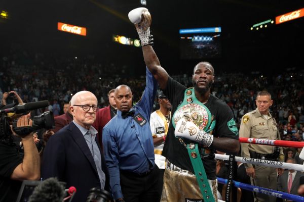 WBC heavyweight champion Deontay Wilder poses with referee Kenny Bayless after defeating Luis Ortiz in their title fight at MGM Grand Garden Arena on November 23, 2019 in Las Vegas, Nevada. Wilder won with a seventh-round knockout.  PHOTO | AFP