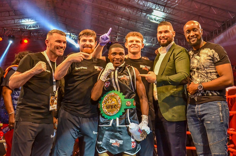 WBC women Super Bantamweight champion, Fatuma 'Iron Fist' Zarika (centre), poses with SportPesa CEO, Captain Ronald Karauri (right), British icon and retired former WBC cruiserwight titleholder, Tony Bellew (second right) and her three coaches from the United Kingdom after holding on to her belt in Nairobi Fight Night 2 at KICC on Saturday, March 23. PHOTO/Brian Kinyanjui/SPN