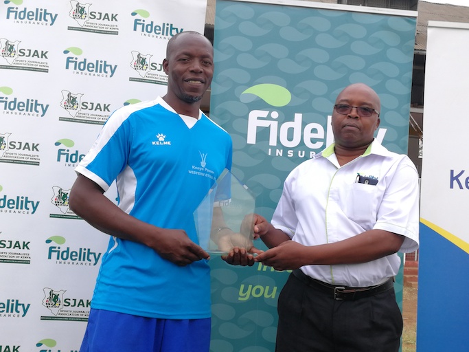 Western Stima FC head coach, Paul Ogai (left) receives the Fidelity Coach of The Month Award on Tuesday, February 5, 2019. PHOTO/Courtesy