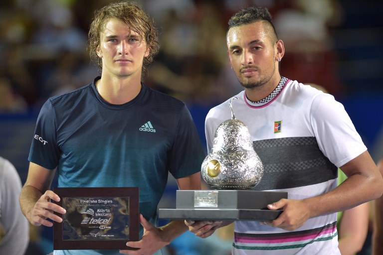 Winner Australian tennis player Nick Kyrgios (R) and German tennis player Alexander Zverev hold their trophies after the Mexico ATP Open men's singles tennis final in Acapulco, Guerrero state on March 2, 2019. PHOTO/AFP
