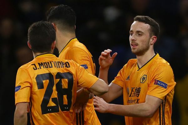 Wolverhampton Wanderers' Portuguese midfielder Diogo Jota (R) celebrates scoring the opening goal during the UEFA Europa League round of 16 first leg football match between Wolverhampton Wanderers and Espanyol at the Molineux stadium in Wolverhampton, central England on February 20, 2020. PHOTO | AFP