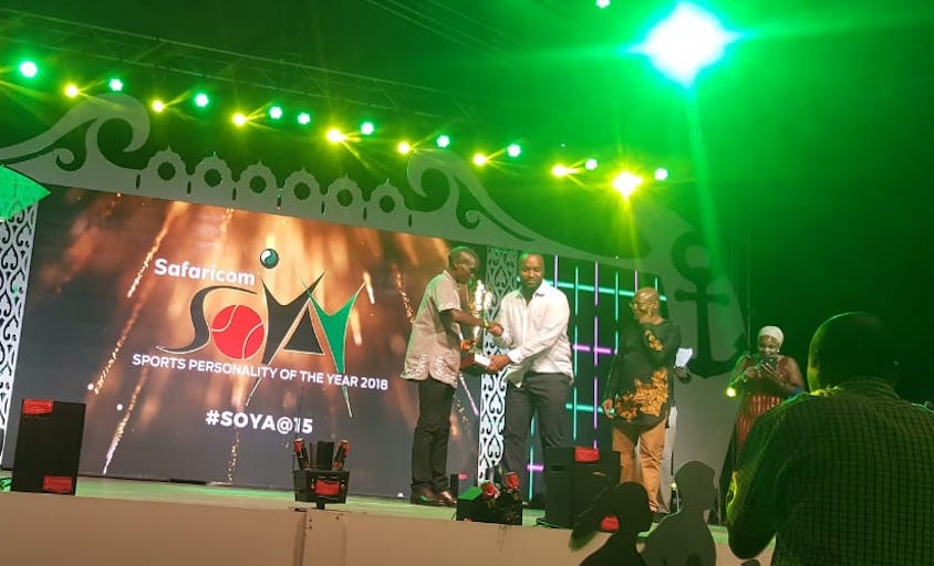 World marathon record holder, Eliud Kipchoge (left) receives the 2018 Male Sports Personality of the Year trophy from Mombasa Governor Hassan Ali Joho (centre) at the Safaricom Sports Personality of the Year Awards held at the Fort Jesus on Friday, January 11, 2018. PHOTO/Courtesy/Capital FM