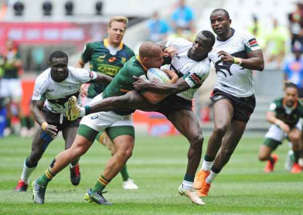 Zain Davids of South Africa is challenged by Daniel Taabu of Kenya during day 3 of the 2019 HSBC Cape Town Sevens at Cape Town Stadium on 15 December 2019. PHOTO | PA Images