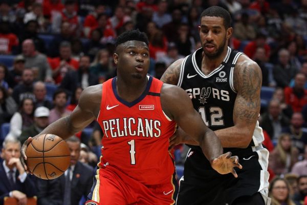 Zion Williamson #1 of the New Orleans Pelicans drives the ball around LaMarcus Aldridge #12 of the San Antonio Spurs at Smoothie King Center on January 22, 2020 in New Orleans, Louisiana. PHOTO | AFP